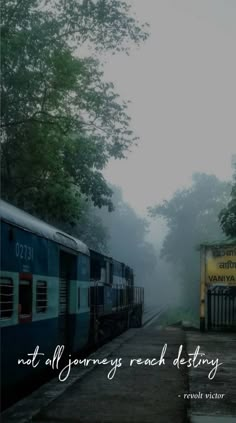 two trains parked next to each other on train tracks in the foggy forest with a quote about not all journey reaching