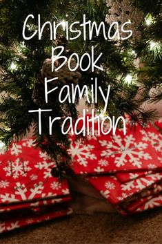 a christmas tree with presents under it and the words christmas book family tradition