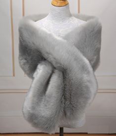 a mannequin wearing a white fur stole