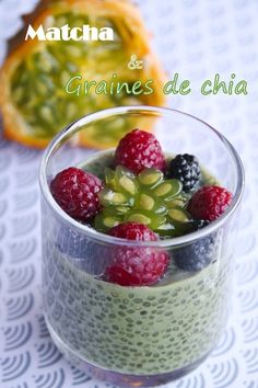 a small glass filled with fruit on top of a table