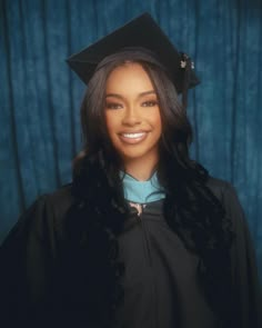 a woman wearing a graduation cap and gown