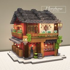 an image of a house made out of legos with lights on the roof and windows