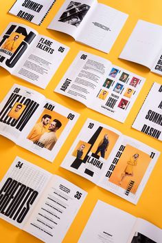 an assortment of brochures are displayed on a yellow surface with black and white images