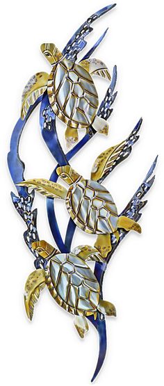 a metal wall hanging with blue and gold sea turtle designs on it's sides