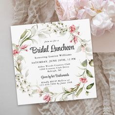 an elegant floral bridal luncheon party with pink flowers and greenery on the table