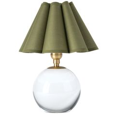 a white table lamp with a green shade on it