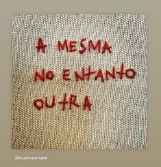 a piece of cloth with words written in red ink on the side and bottom of it