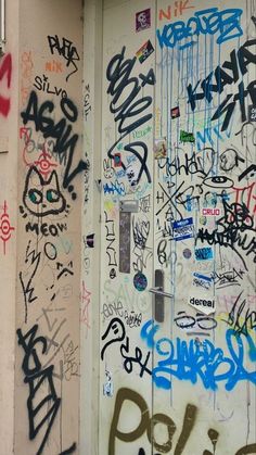 the door is covered with lots of graffiti