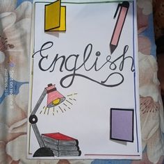 an english book with writing on it and a lamp next to it that says english