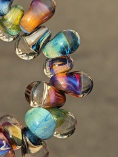 multicolored glass beads hanging from a hook