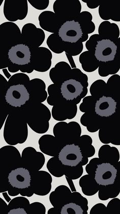 black and white flowers are in the middle of a wallpaper pattern with grey circles on it