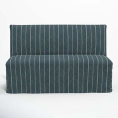 an upholstered couch with blue and white pinstripe fabric on the back