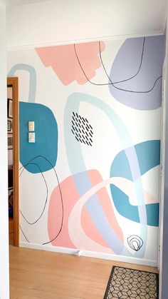 the wall is painted with colorful lines and shapes