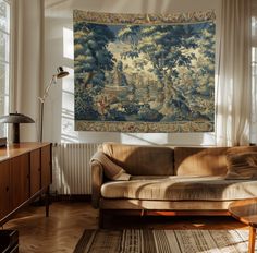 a living room with a large tapestry hanging on the wall