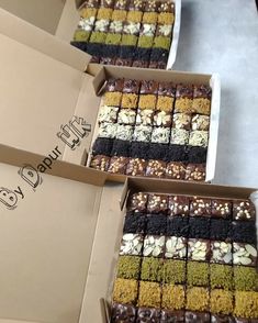 four boxes filled with different types of brownies