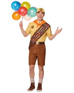 a man in a costume is holding balloons