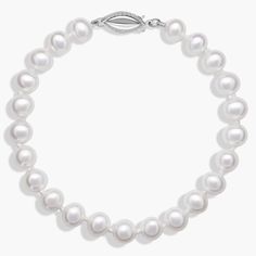 Classically luminous, this Freshwater cultured pearl bracelet features nearly-round white pearls strung on a hand-knotted 6.5" silk blend cord. A polished 14k white gold safety clasp secures the look. Elegant Pearl Bracelet With Sterling Silver Clasp, Elegant White Gold Pearl Bracelet With Sterling Silver Clasp, White Gold Pearl Bracelets With Round Beads, Elegant Adjustable Single Strand Pearl Bracelet, Formal White Hand-strung Jewelry, Pearl White Single Strand Bracelet With Round Beads, Pearl Bracelet With Sterling Silver Clasp And Round Beads, Elegant Round Pearl Bracelet With Sterling Silver Clasp, Elegant White Pearl Bracelet With Sterling Silver Clasp