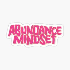 the word abundance mindset in pink sticker