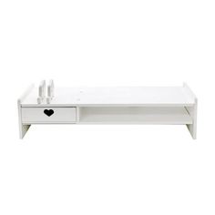 a white coffee table with two drawers on one side and an open drawer on the other