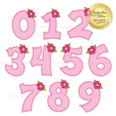 the numbers are decorated with pink polka dots and flowers on them, as well as green leaves