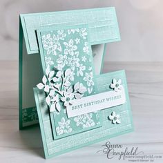 a close up of a birthday card with flowers on the front and back side,