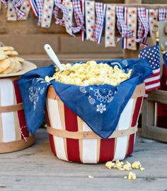 an american flag bucket full of popcorn on the porch