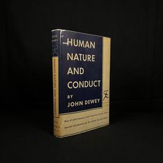 a book with the title human nature and conduct by john dewey written in blue