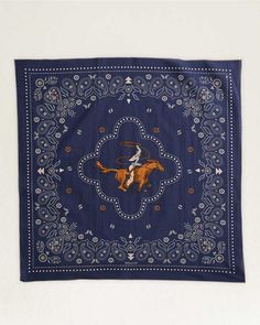 a blue bandanna with an image of a man on a horse in the middle