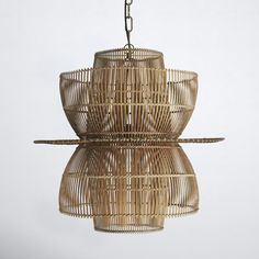 a bamboo chandelier hanging from a chain