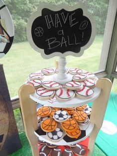 cupcakes and cookies are arranged on a stand