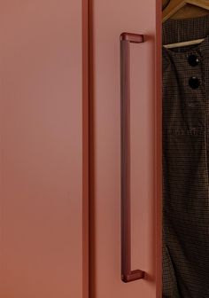 an open pink door with a handle on the front and back doors are shown in this image