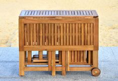 a wooden cart sitting on top of a sidewalk