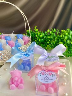 small pink and blue candies are on a plate with a basket in the background