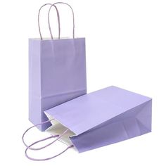 purple paper bags with handles on white background