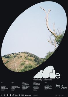 a poster with an image of a tree on top of a hill in the background