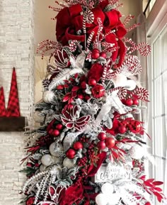 a christmas tree with red and white decorations