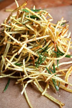 a pile of fried food sitting on top of a cutting board