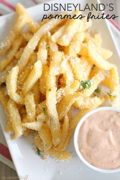 a white plate topped with fries covered in sauce