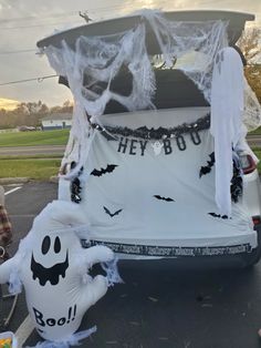 an inflatable car decorated for halloween with ghost and bat decorations on the back