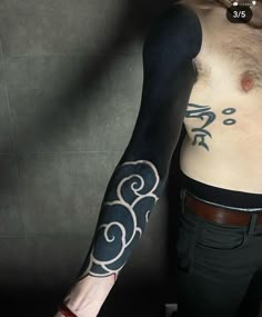 a man with a tattoo on his arm