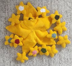 a group of knitted toys laying on the floor