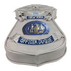 the new york police officer badge is shown in this silver and blue tinsele