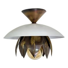 an art deco light fixture with white glass and bronze leaf decoration on the bottom, against a white background