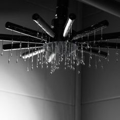 a chandelier hanging from the ceiling in a bathroom