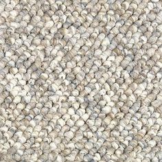 a close up view of the texture of a carpet with white and gray colors on it