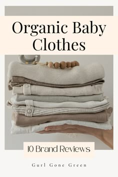 a stack of folded clothes with the title organic baby clothes 10 brand reviews by curl gone green