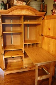 an old fashioned wooden desk with shelves and drawers