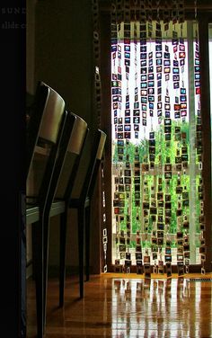 chairs are lined up in front of a window with glass blocks on the outside and inside