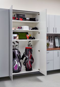 an open garage storage cabinet with golf bags and equipment in the bottom shelf, text overlay reads how to fix the top 10 garage storage problems