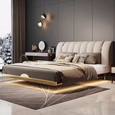 a bedroom with a large bed in the middle of it and lights on either side